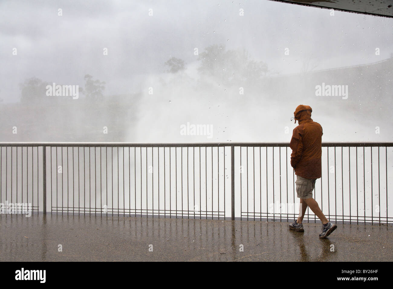 Man standing on the viewing platform watching the overflow from the ...