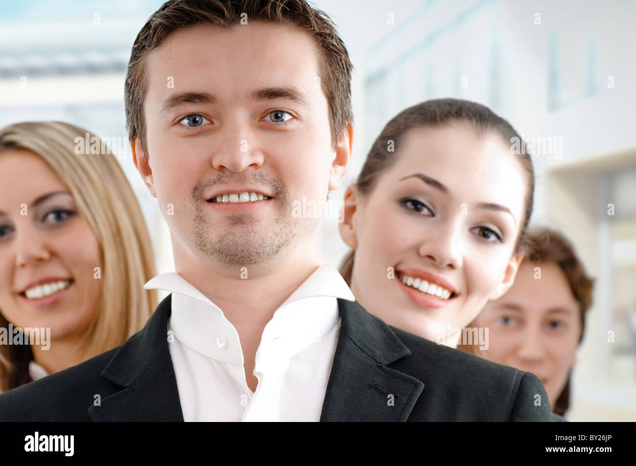 team of successful smiling young business people Stock Photo - Alamy