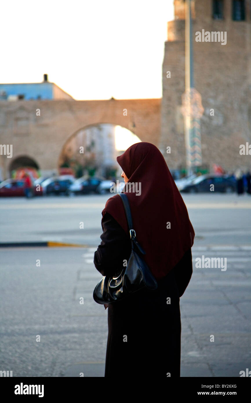 Tripoli, Libya, Tripolitania; A veiled Muslim woman just about to enter Tripoli's Ancient Medina from the Main Gate just off Stock Photo