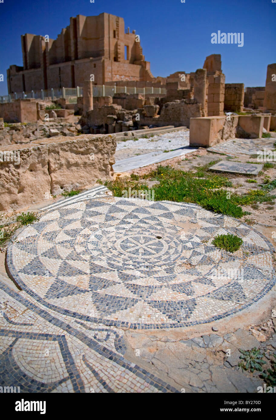 Sabratha, Libya; An elegant mosaic and remains of the Theatre in the background from the Ancient Roman City lying just off the Stock Photo