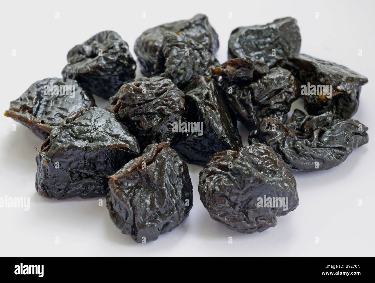 Dried Prunes on a White Background Stock Photo