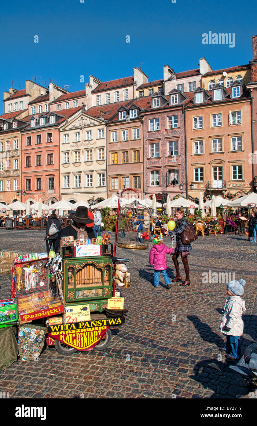 Older man who plays old fashioned music in middle of Main Old Town Main Square Warsaw Poland Stock Photo