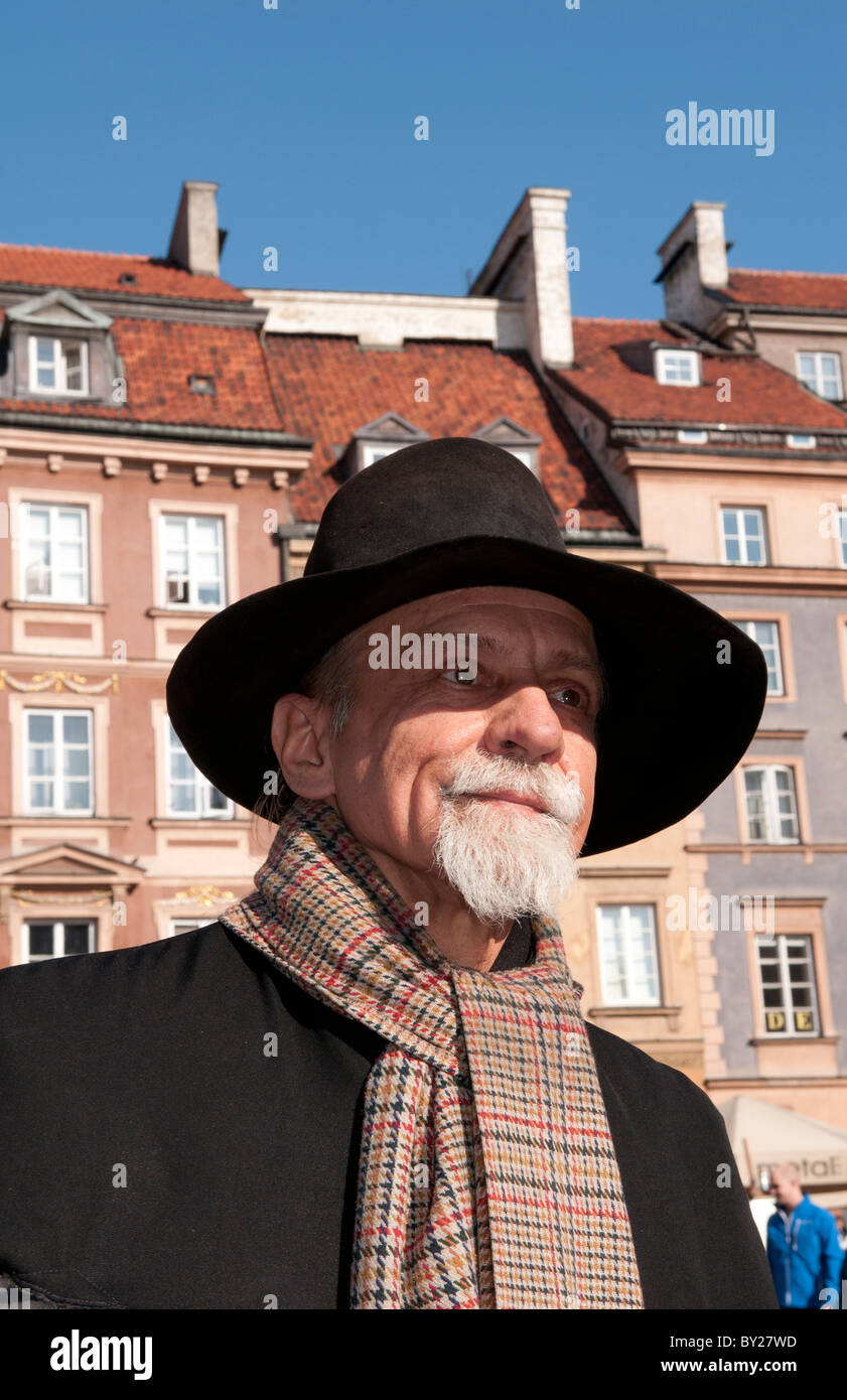 Close up of older man who plays old fashioned music in Main Old Town Main Square Warsaw Poland Stock Photo