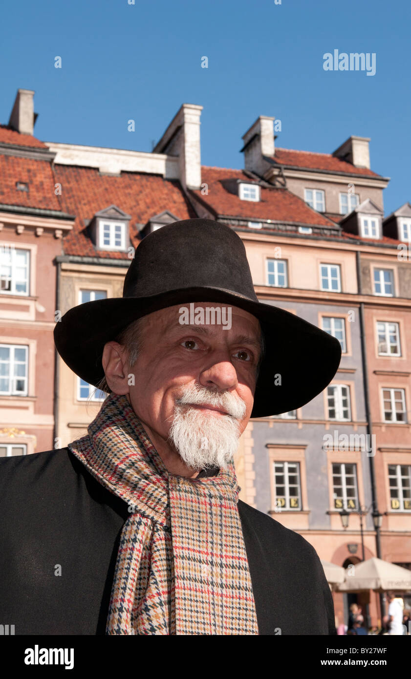 Close up of older man who plays old fashioned music in Main Old Town Main Square Warsaw Poland Stock Photo