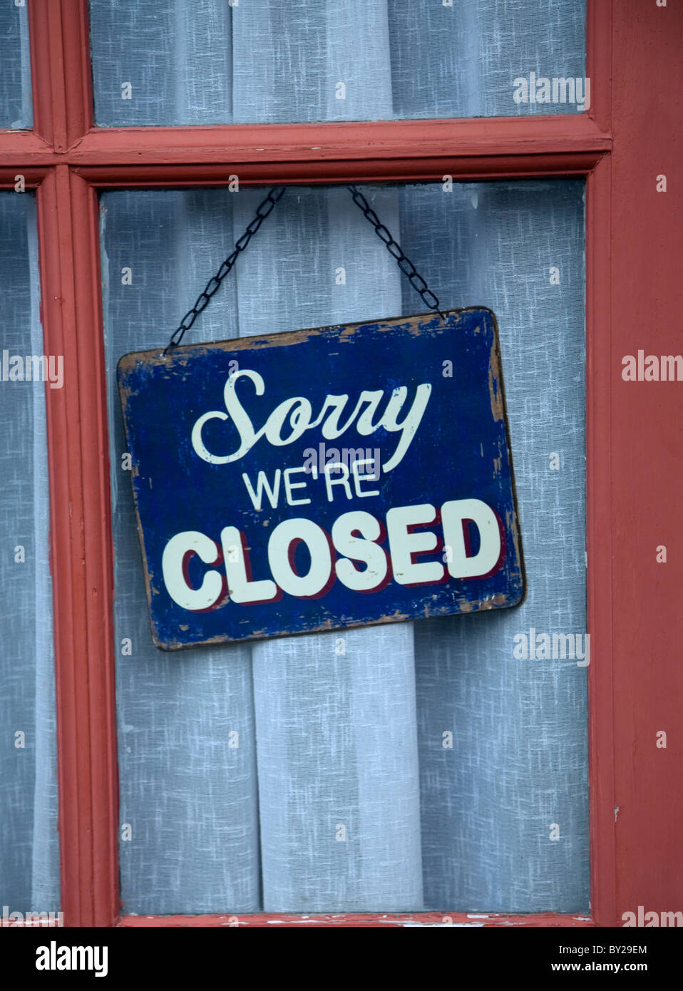 Old Sorry we are Closed shop sign in window Stock Photo Alamy