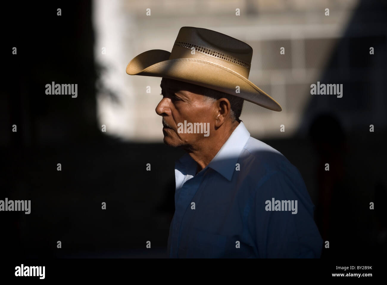 A Central American migrant stands in a shelter located along the railroad in Ixtepec, Oaxaca, Mexico. Stock Photo