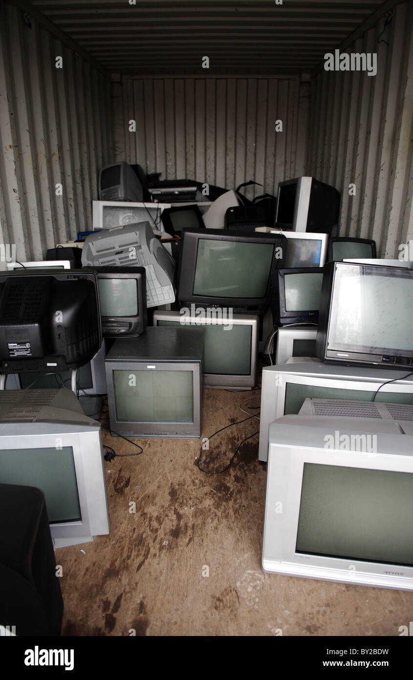 Televisions and computer monitors in a container at a recycling centre in  the UK Stock Photo - Alamy