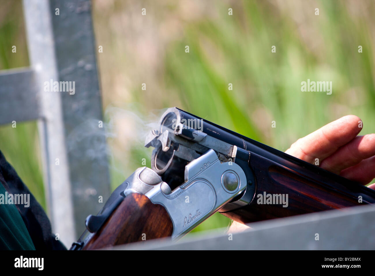 what does it mean to shotgun a cigarette Smoking shotgun hi-res stock photography and images