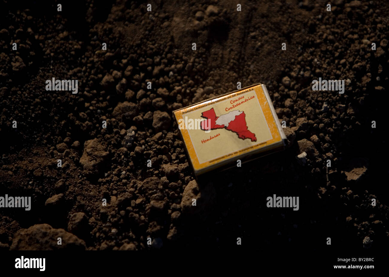 A box of matches covered by a map of Honduras lays on the ground in a shelter for migrants in Ixtepec, Oaxaca, Mexico. Stock Photo