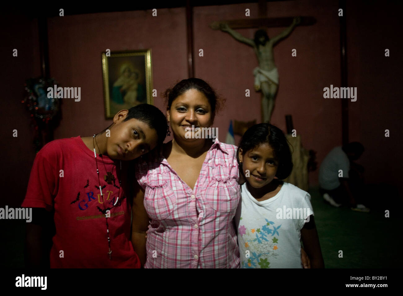 Central American migrants pose for a picture in a shelter located along the railroad in Ixtepec, Oaxaca, Mexico. Stock Photo