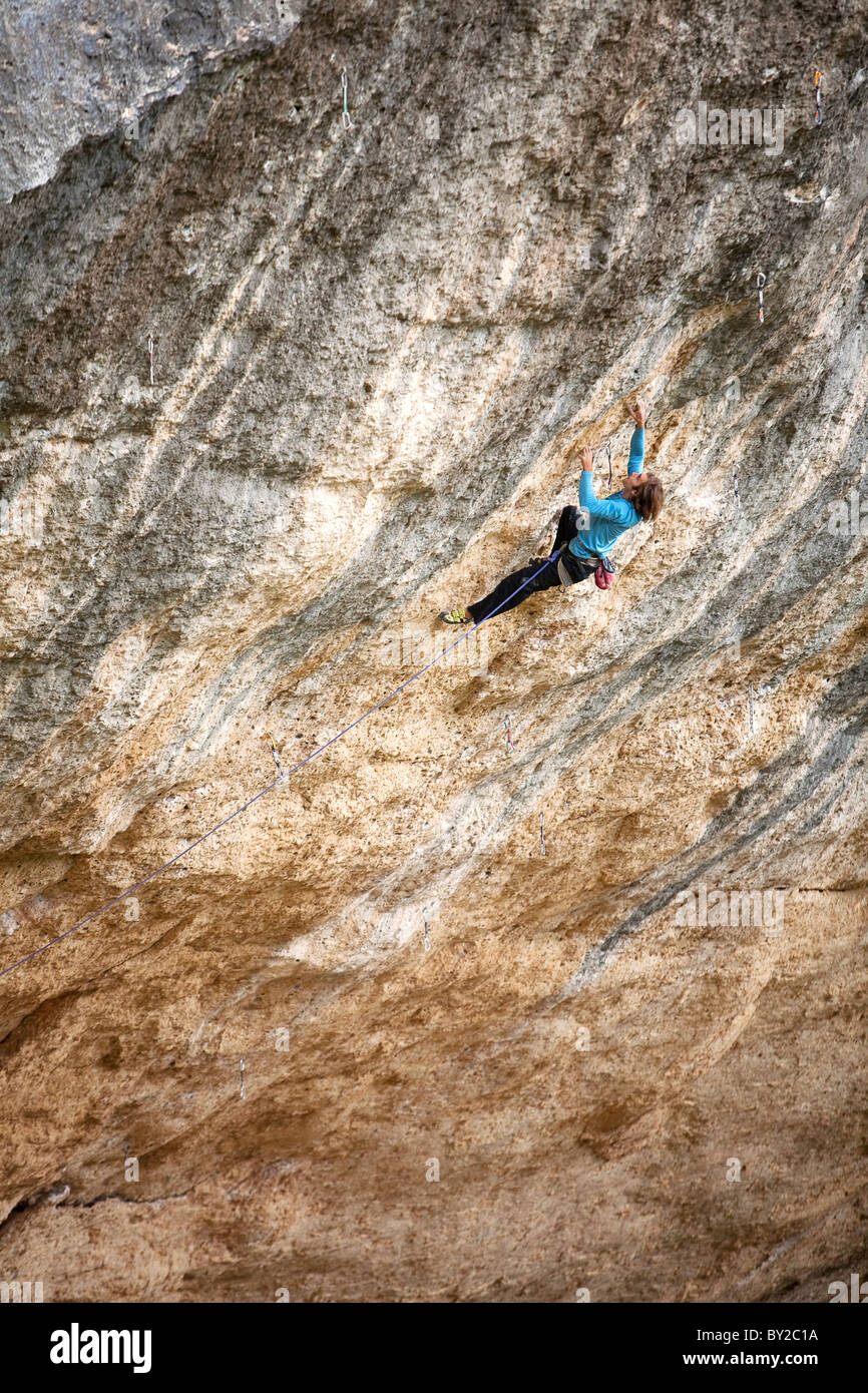 A man rock climbs in Spain. Stock Photo