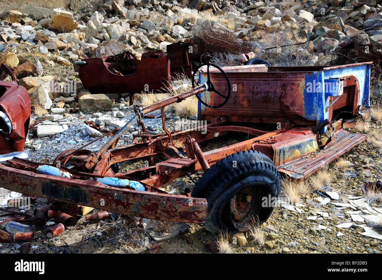 Rusty tractor in a dump. South Africa. Stock Photo