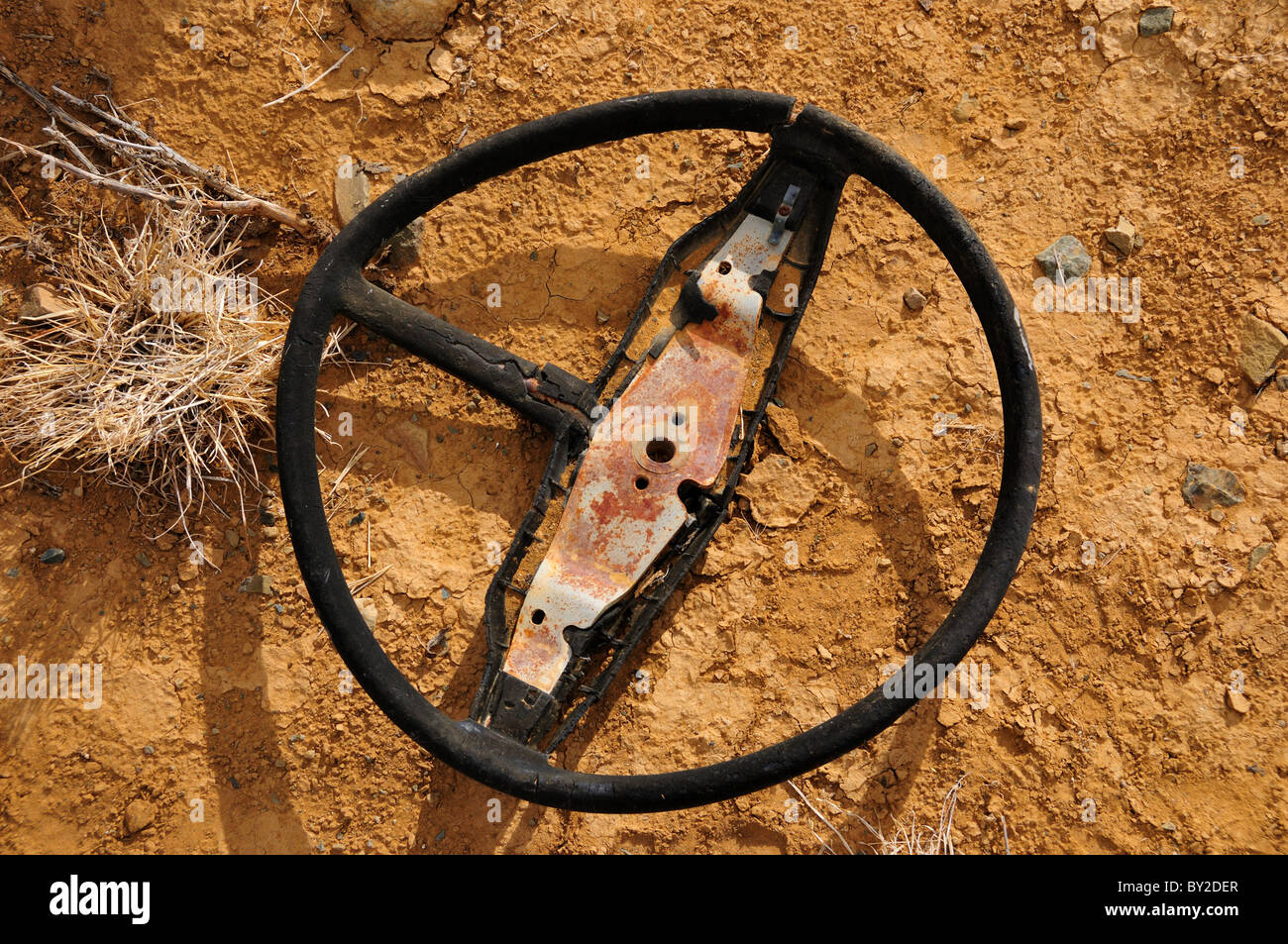 Old broken steering wheel. Stock Photo