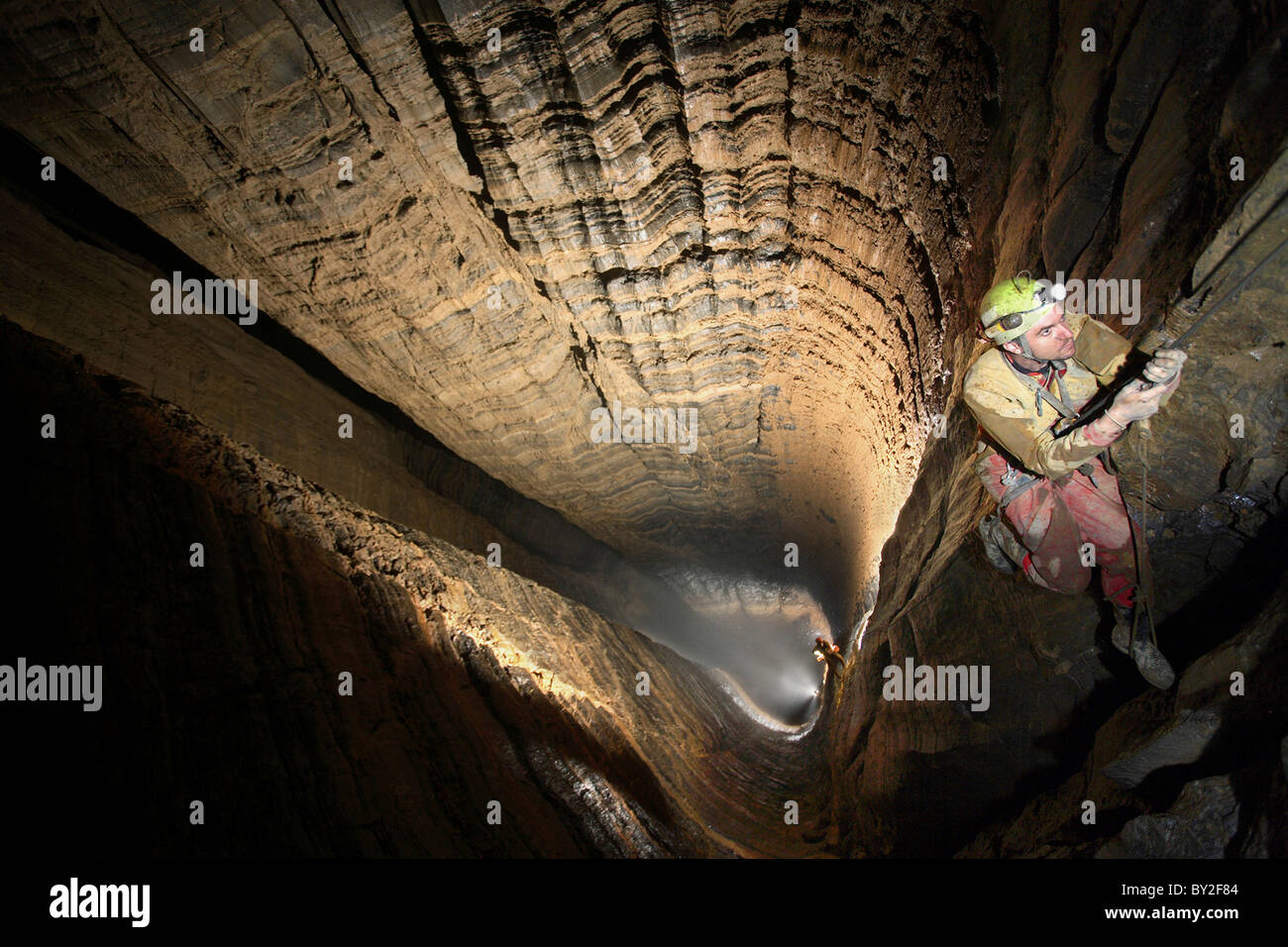 Underground Rope A man ascends the ropes in the largest underground shaft in the world ...