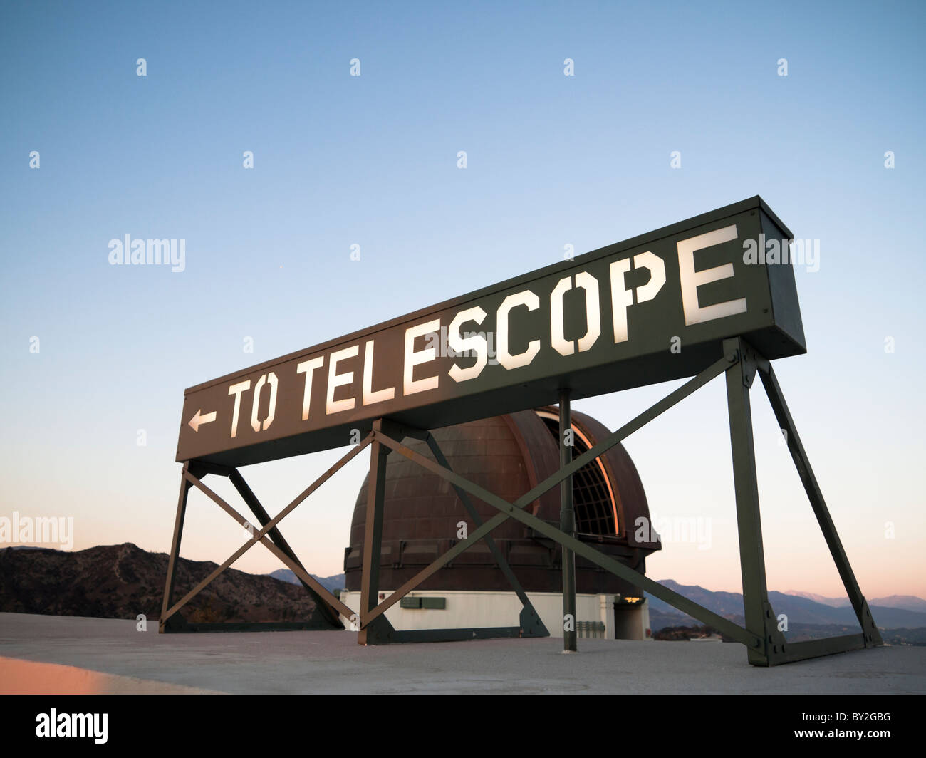 To telescope sign during sunset at the Griffith Park Observatory Los