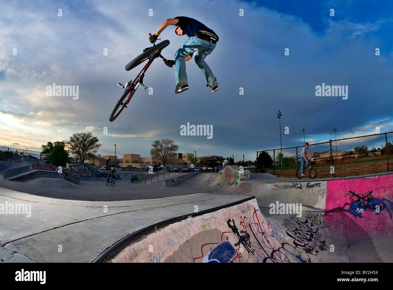 A mountain bike rider does a tailwhip at a skatepark in Santa Fe, NM Stock  Photo - Alamy