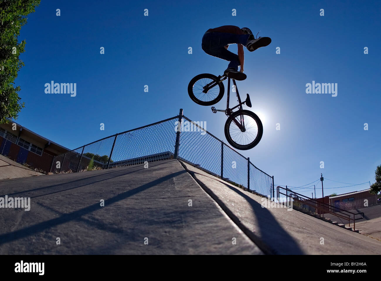 A mountain bike rider does a tailwhip on a concrete bank in Albuquerque, NM Stock Photo Alamy
