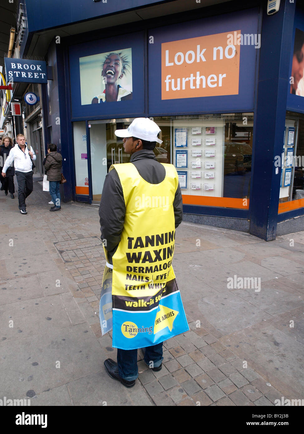 Man advertising with a sandwich board outside a Brook Street employment