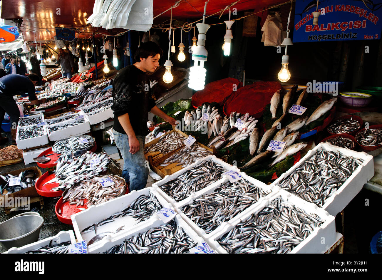 ISTANBUL, Turkey — The historic Karakoy Fish Market stands near the Galata Bridge in Istanbul's waterfront district. This traditional market, known locally as Balik Pazari, serves as a primary seafood trading center for catches from the Bosphorus Strait and Black Sea. The market's location places it at a crucial junction between the Golden Horn and the Bosphorus. Stock Photo