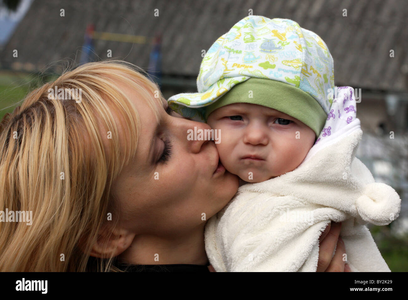 Mother holding cute baby boy Stock Photo Alamy