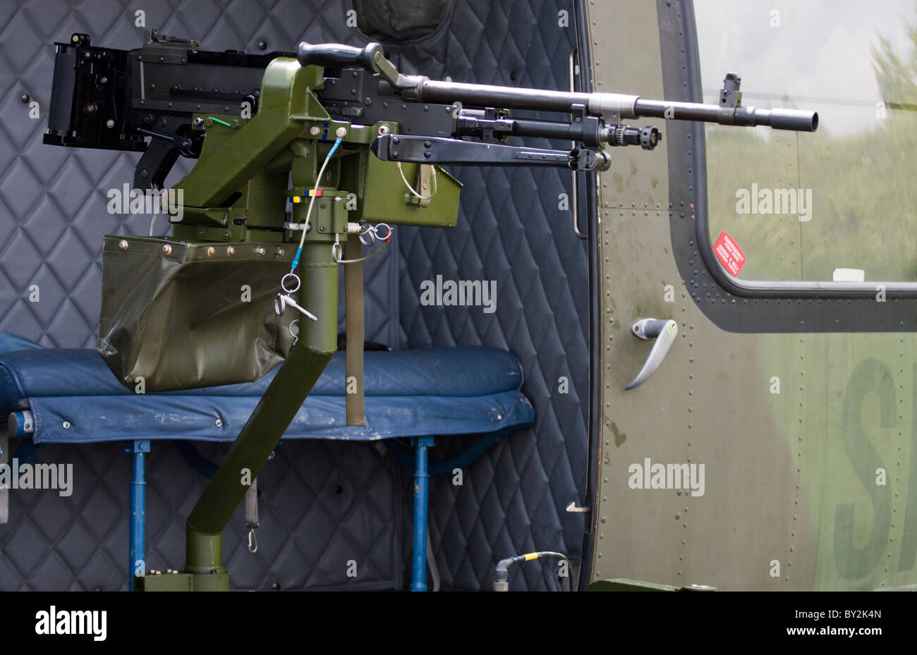 Machine gun mounted by the side of the helicopter. Stock Photo