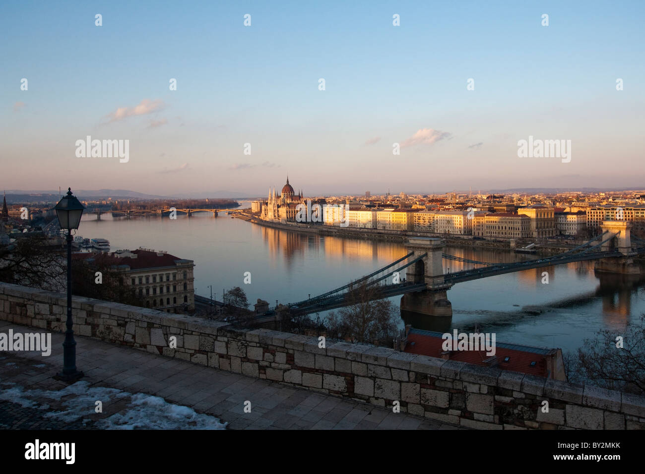 The sun setting over the Parliament buildings in Budapest, Hungary Stock Photo