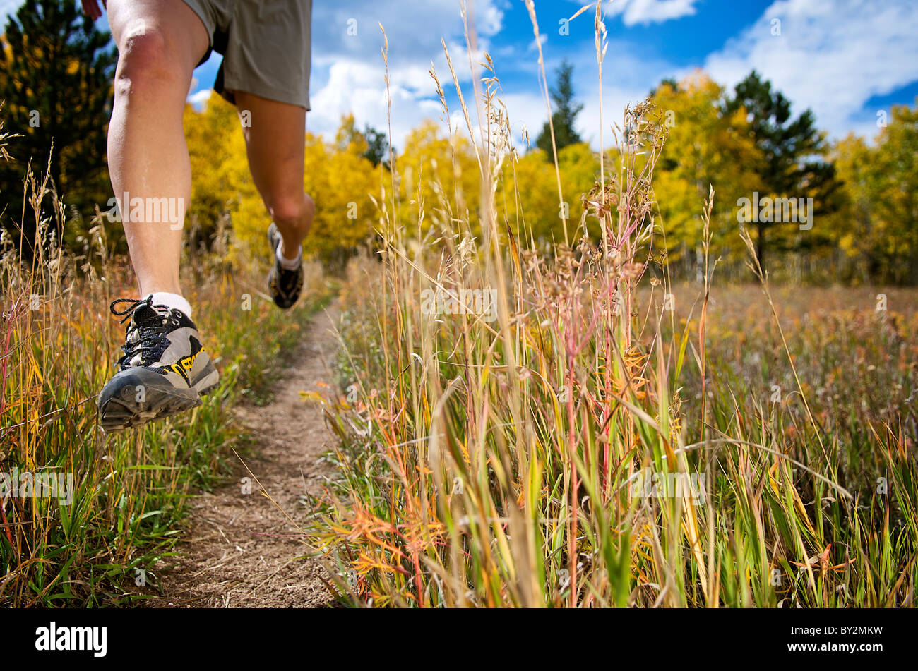 a woman trail running near gold hill, co. Stock Photo