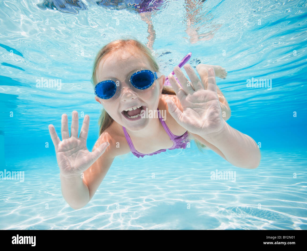 Girl swimming underwater Stock Photo - Alamy