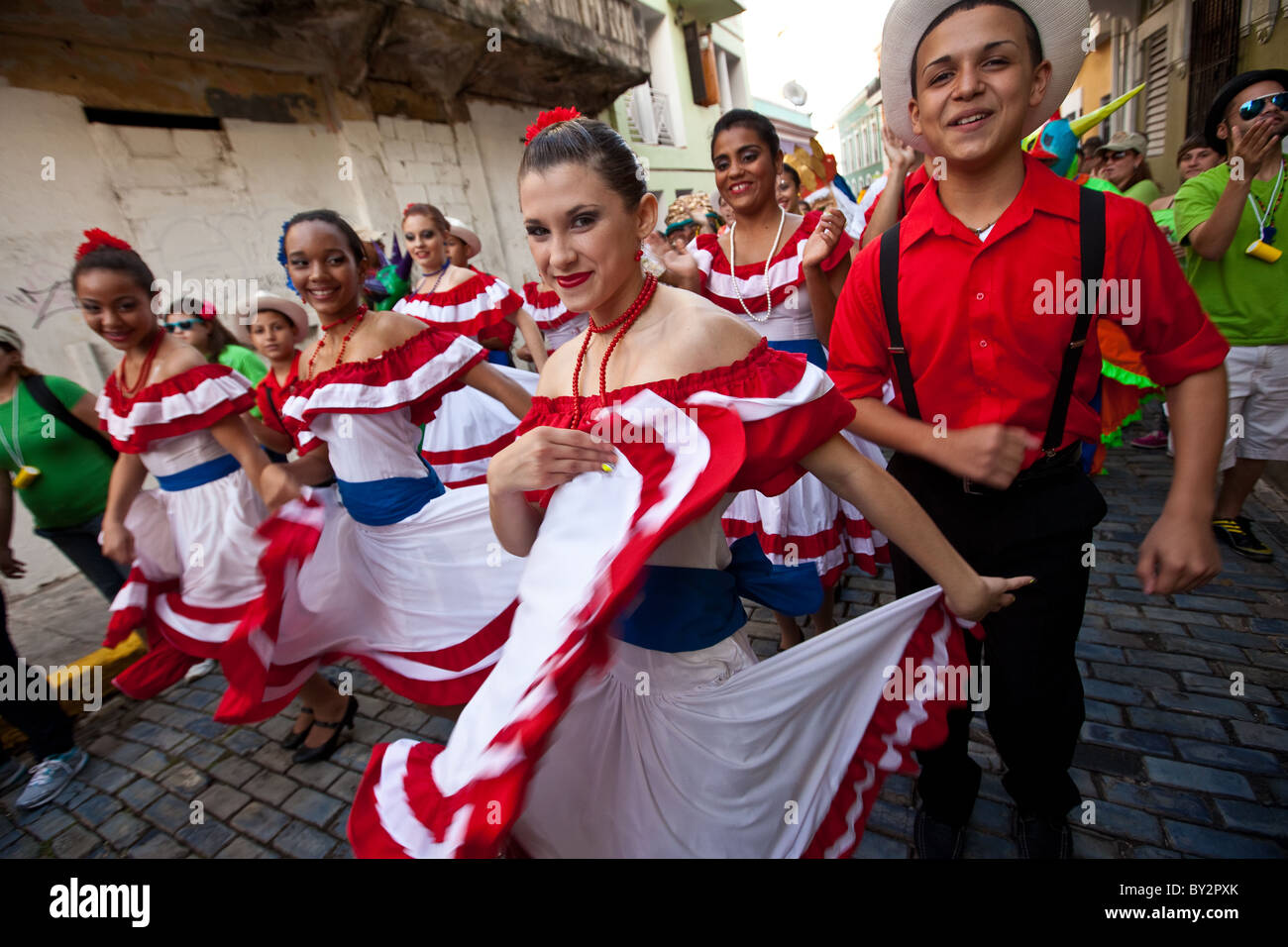 Traditional dancers parade through the streets of Old San Juan during