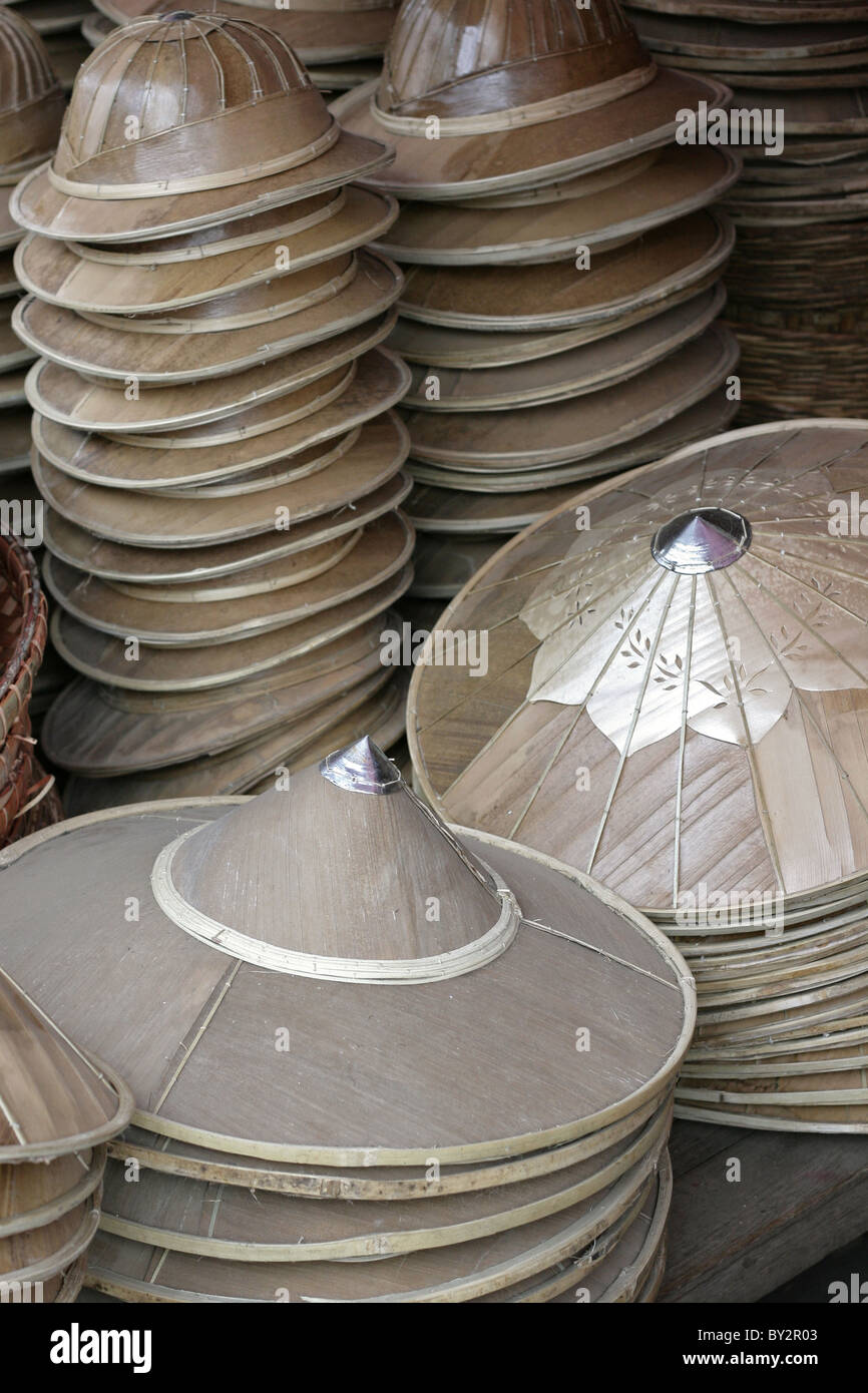 Selection of conical burmese hats and others at the local market in Hsipaw (Tibau), Myanmar Stock Photo