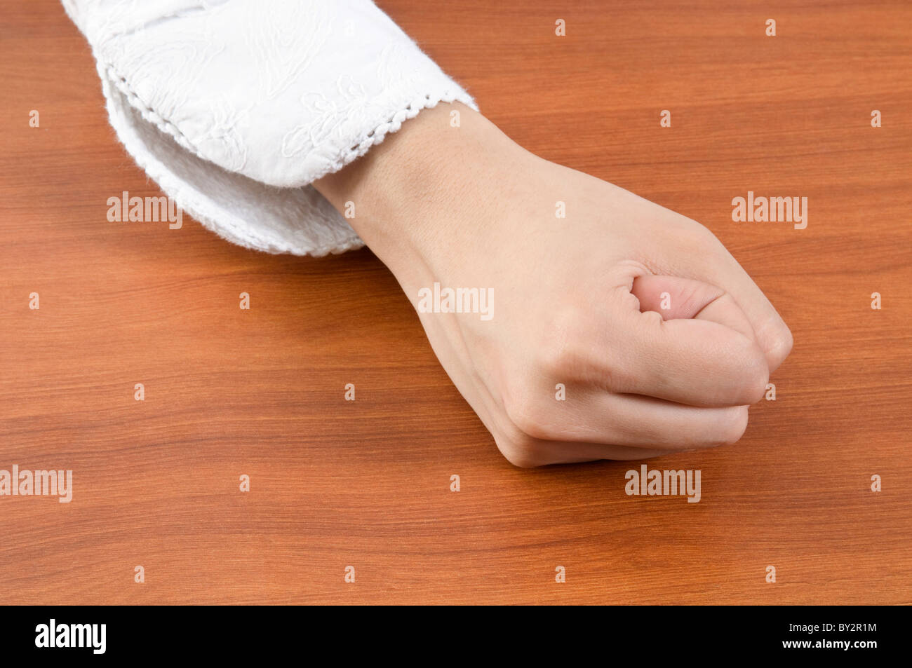 A woman banging her fist. Stock Photo