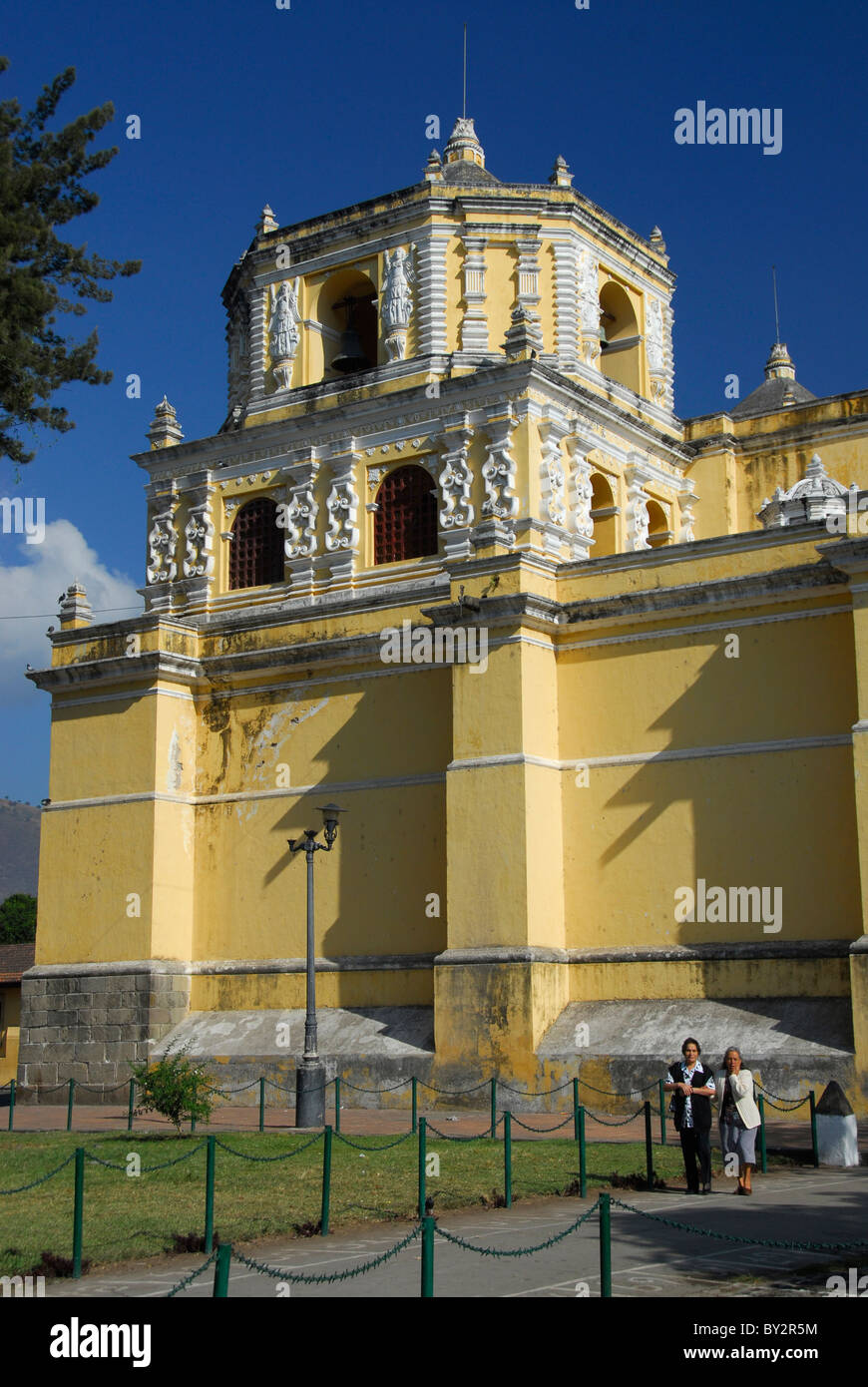 People walking in park beside Nuestra Señora de La Merced Church Antigua, Sacatepequez Department, Guatemala, Central America Stock Photo