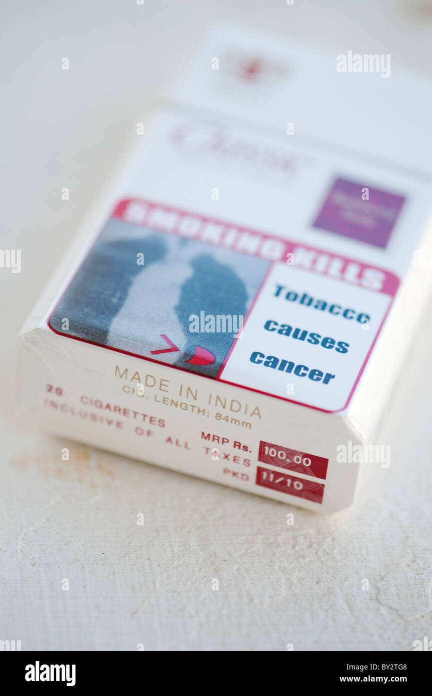Classic India cigarette packet with cancer warnings. Shallow DOF Stock Photo