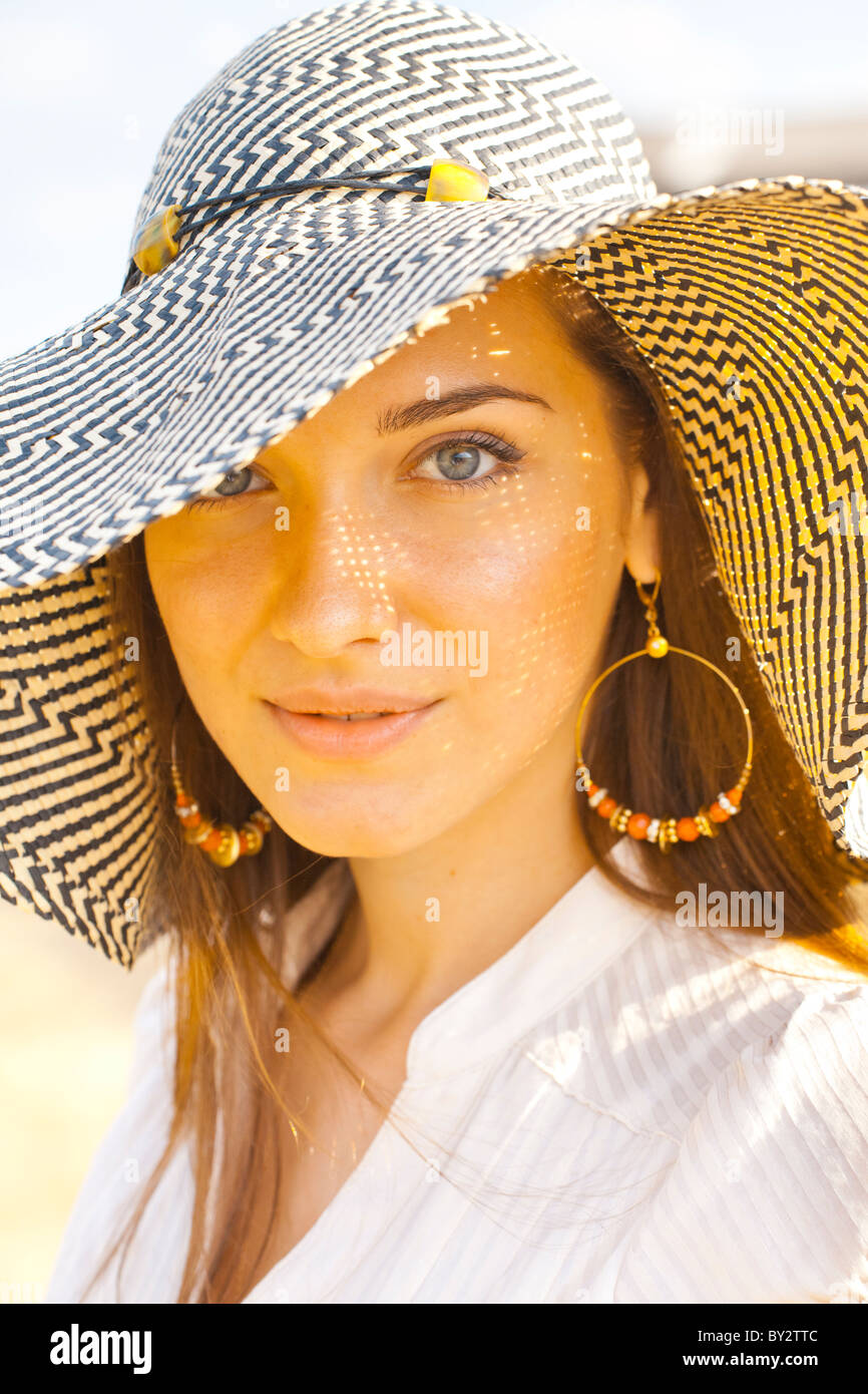 A portrait of a young woman wearing hat Stock Photo - Alamy