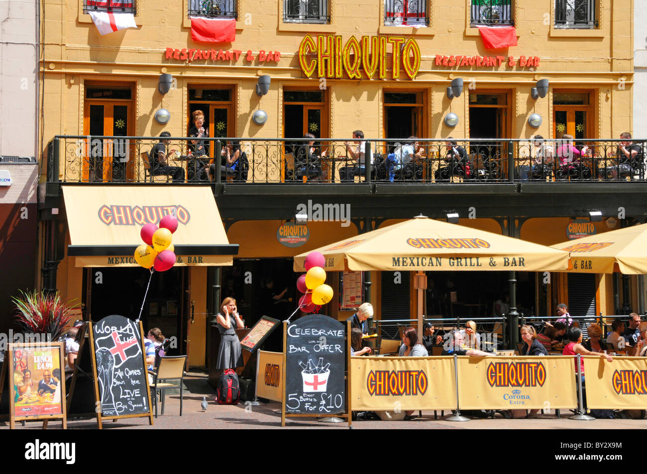 Chiquito balcony & outdoor pavement restaurant and bar in sunny and busy touristy Leicester Square West End London England UK Stock Photo