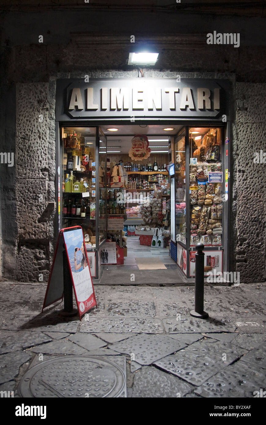 Alimentari or food shop in the Spaccanapoli street of Naples, Italy Stock Photo