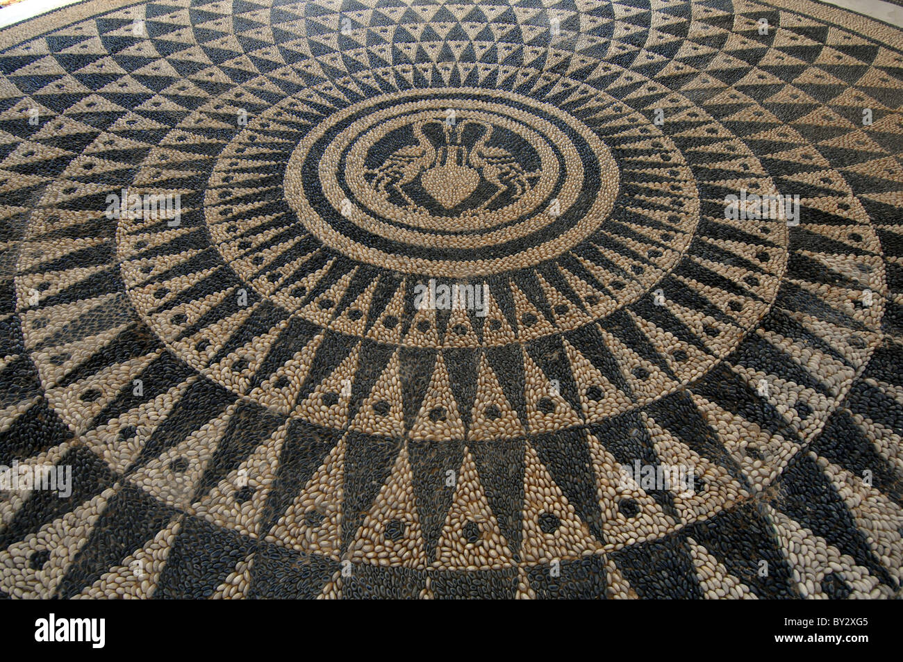 Kalithea Thermal Spa, Rhodes: its ornate pebble mosaic floor in traditional greek style. Stock Photo