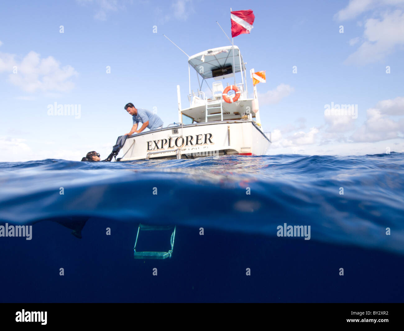 Split image dive boat over under Stock Photo
