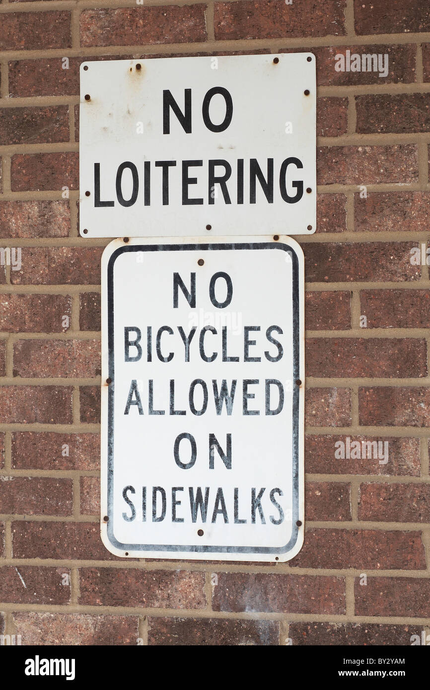 No Loitering no bicycles allowed on sidewalks Stock Photo