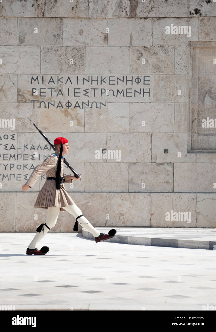 Closer view of the Athens guard's attire, Pom-pom-laden clogs, short pleated skirts and pony-tail-tasselled hats. Stock Photo