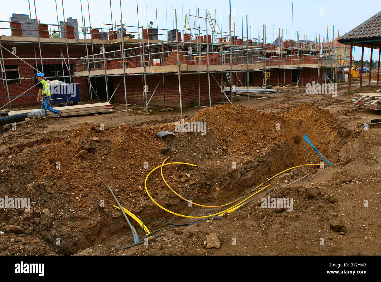 Trench in the ground around a new housing development under ...