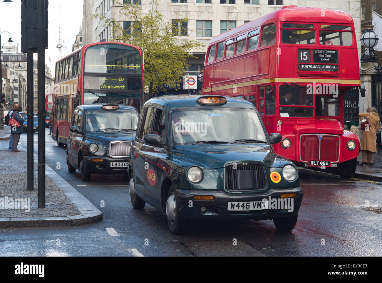 A Routemaster double-decker bus operates on heritage route 15 in traffic in front of Charing Cross Station in London, England, UK. Stock Photo