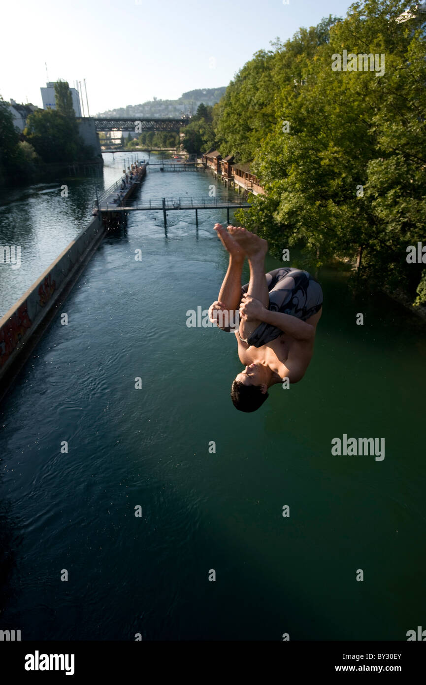 Jumping into the Limmat River in Lower Letten bathing place, Zurich, Switzerland Stock Photo