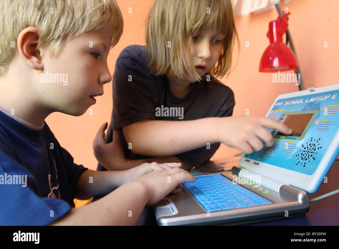 Two Children Learning From A Children S Computer Stock Photo Alamy