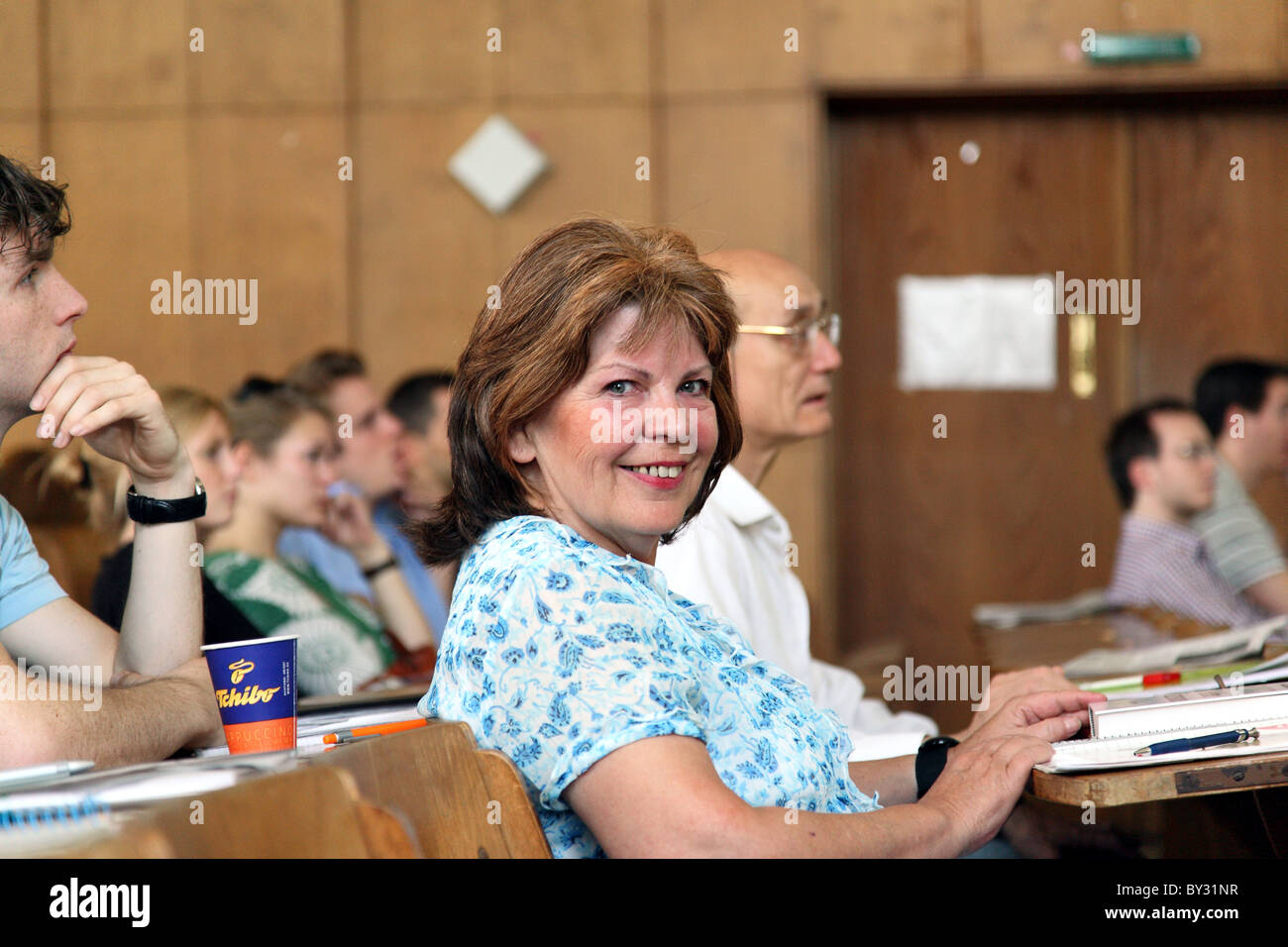 A pensioner in a lecture hall Stock Photo