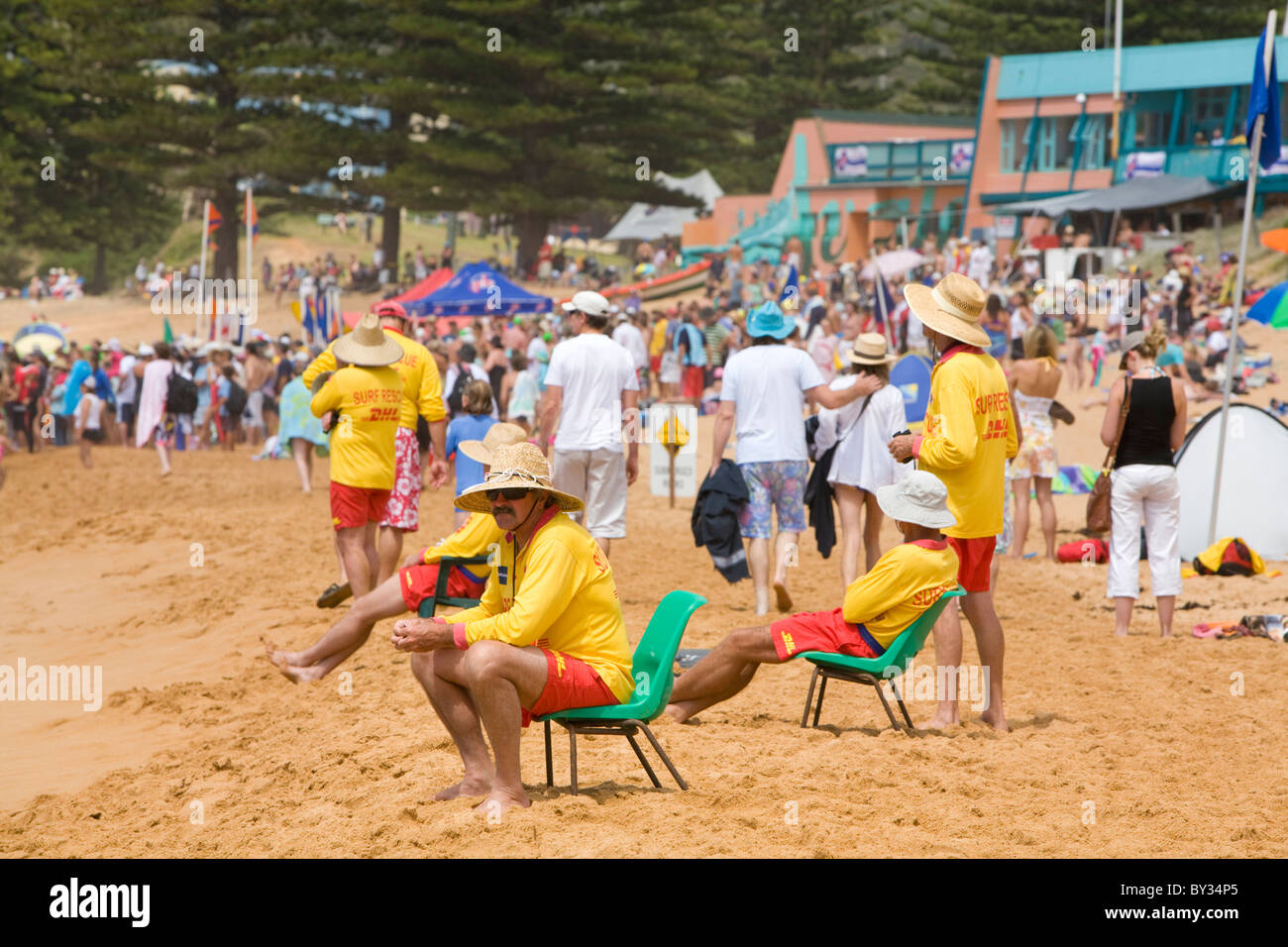 surf rescue lifeguards take a rest on avalon beach whilst watching the surf,australia Stock Photo