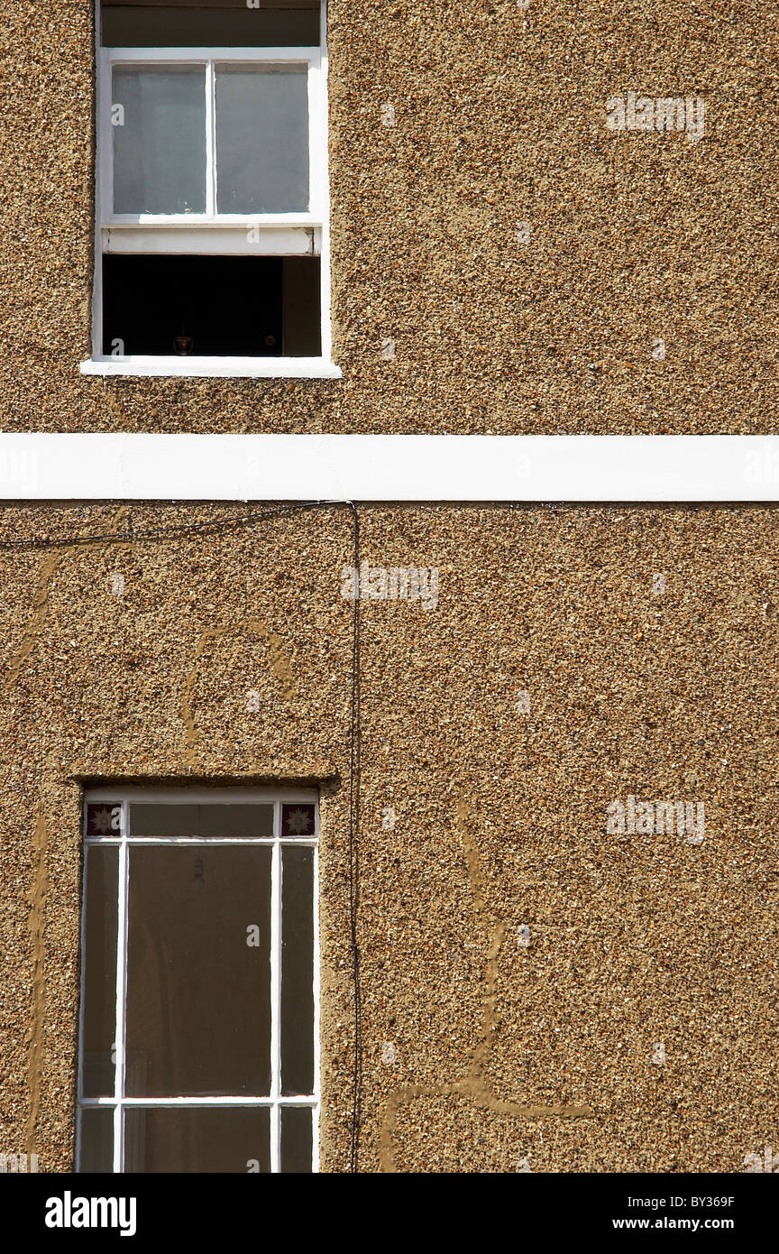 Pebble dash facade of a suburban house London UK Stock Photo