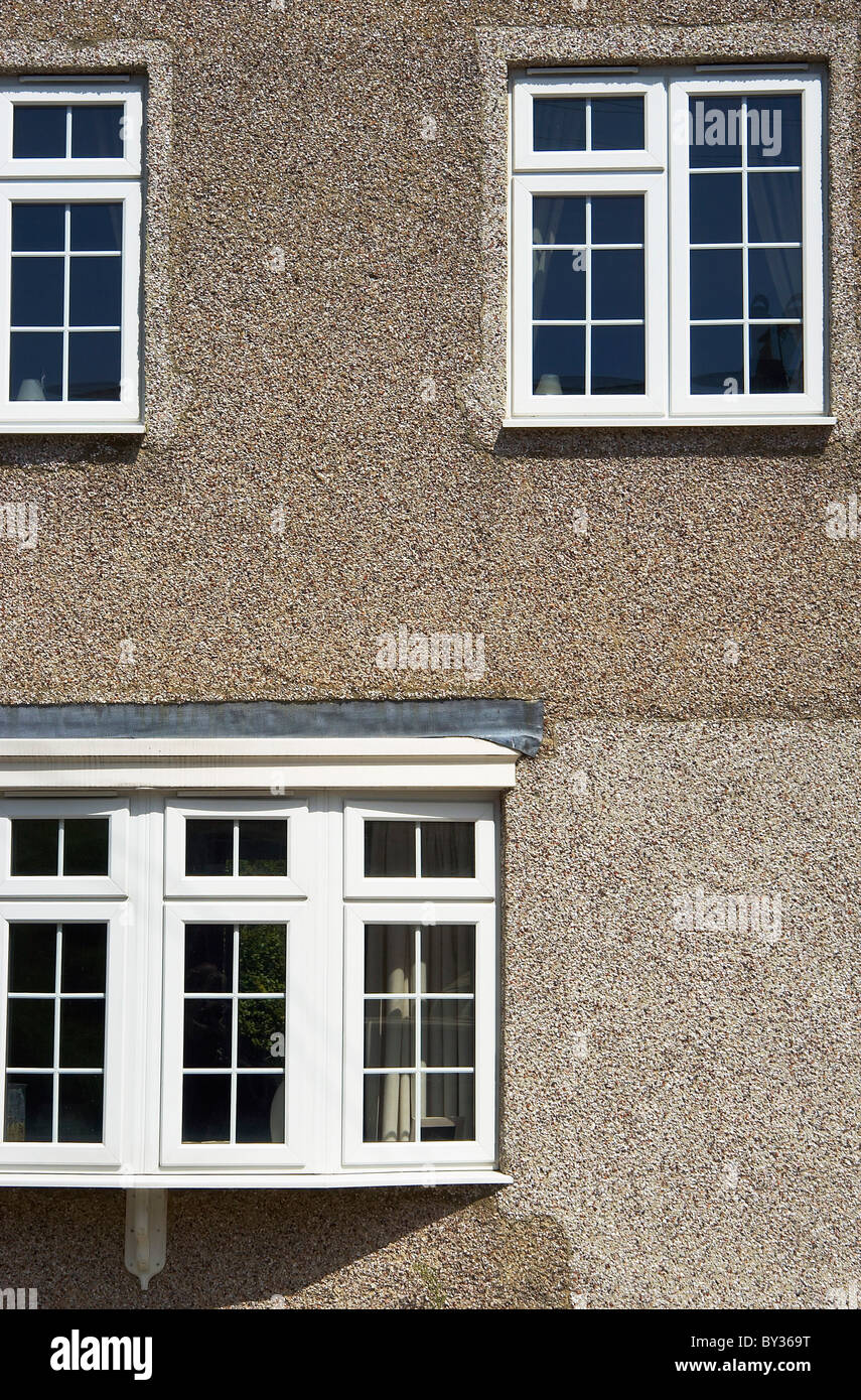 Pebble dash facade of a suburban house London UK Stock Photo