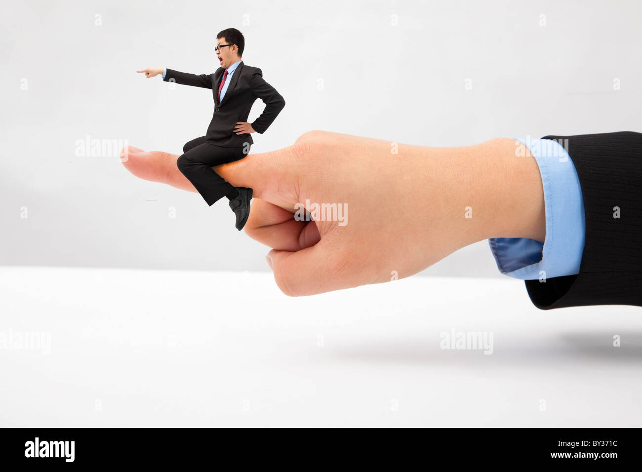 Business concept.Businessman sitting on the finger shouting and blaming Stock Photo