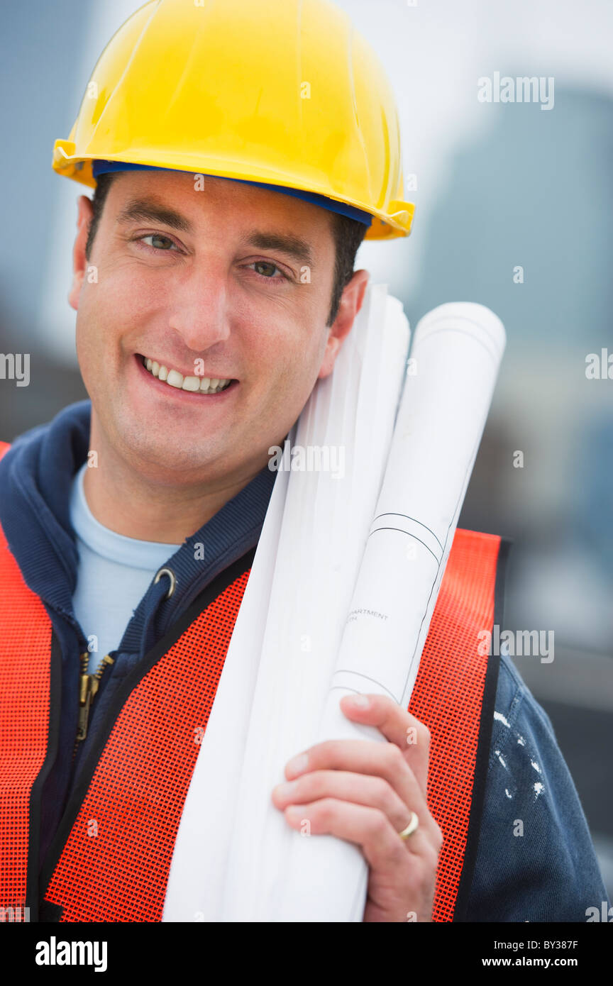 Rolled architectural blueprints construction plans hires stock